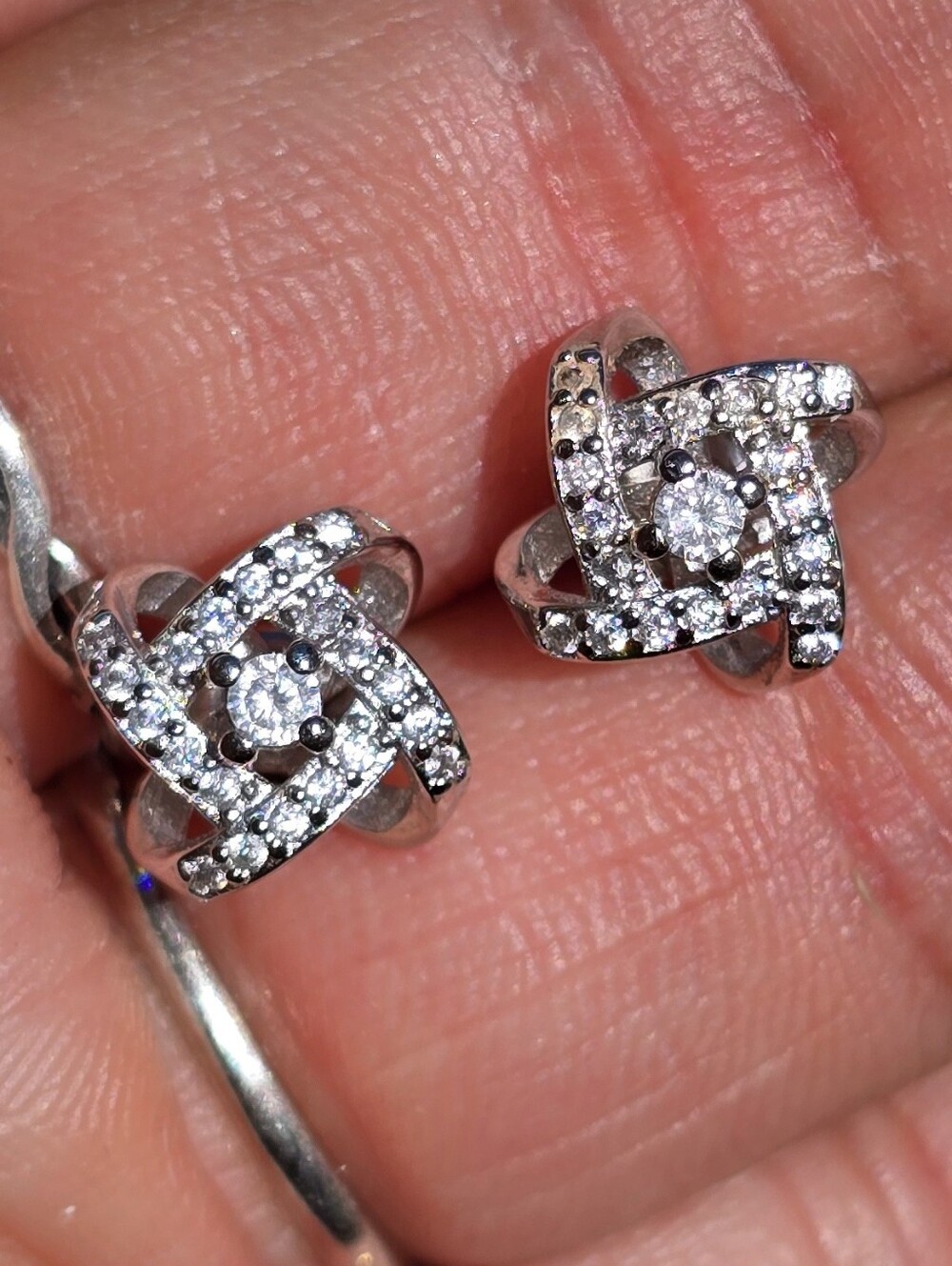 Classic and elegant stamped love knot CZ diamond studs earrings